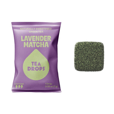 A purple Lavender Matcha Tea Drop – Calm Energy in Every Sip 💜🍵 packet sits beside a green, textured tea drop. The naturally sweetened, caffeinated green tea contains organic matcha and provides one 0.25 oz (7g) drop.